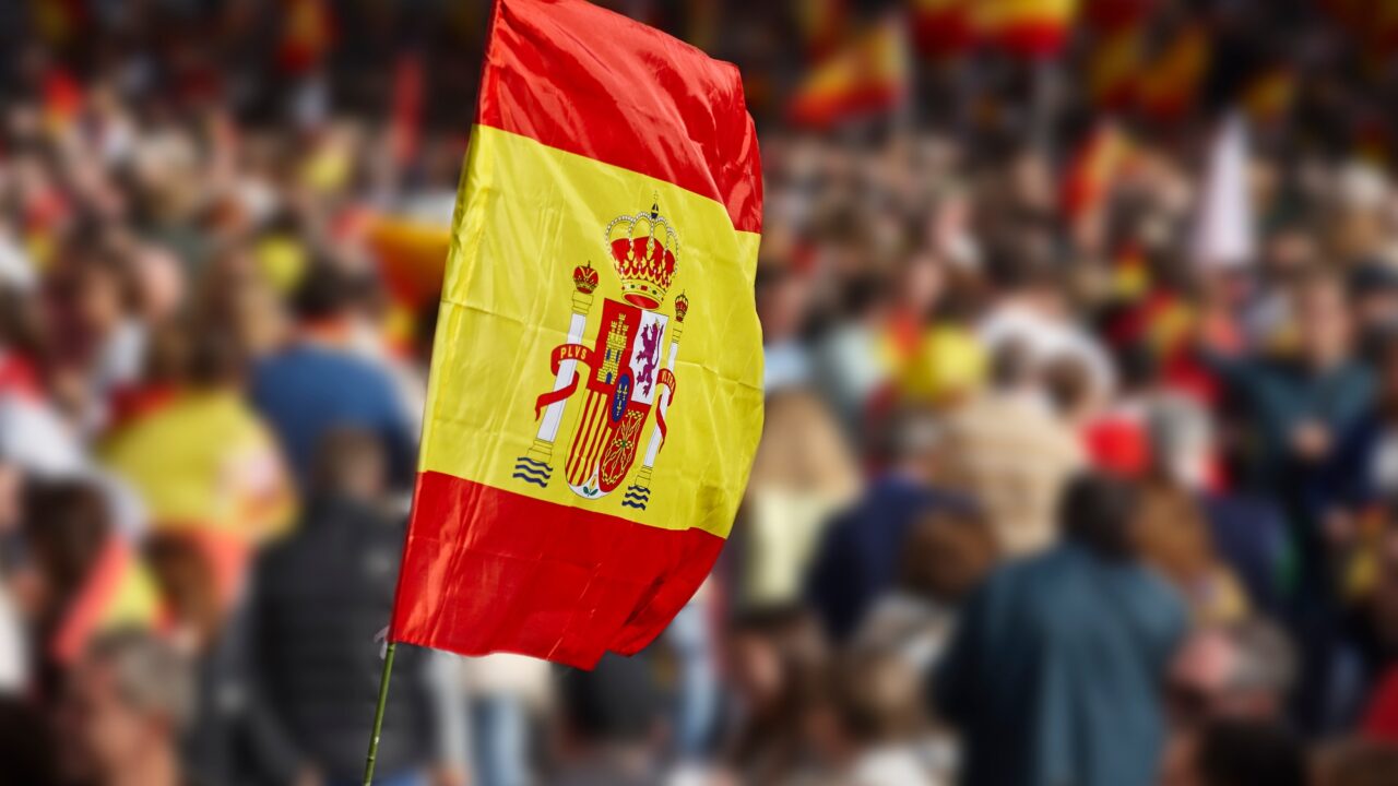 Spanish flag waving. Demonstration in Spain. Spanish symbol