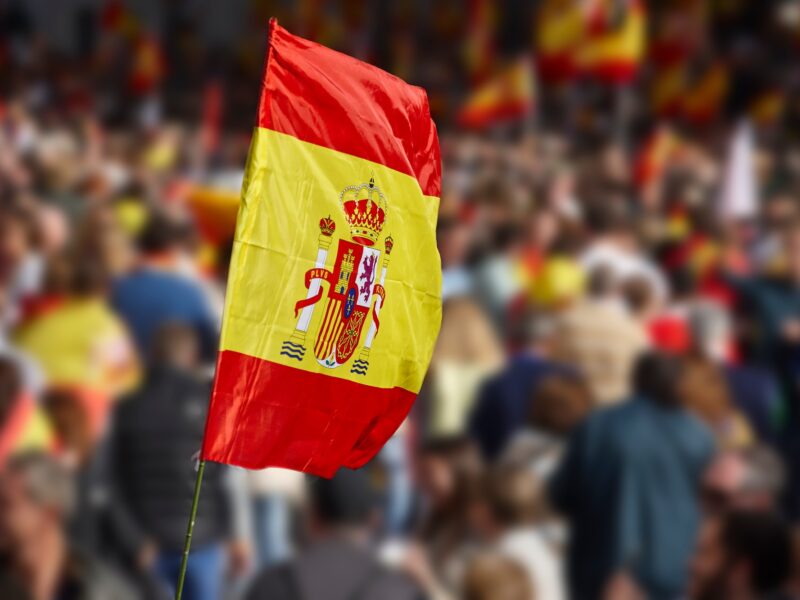Spanish flag waving. Demonstration in Spain. Spanish symbol