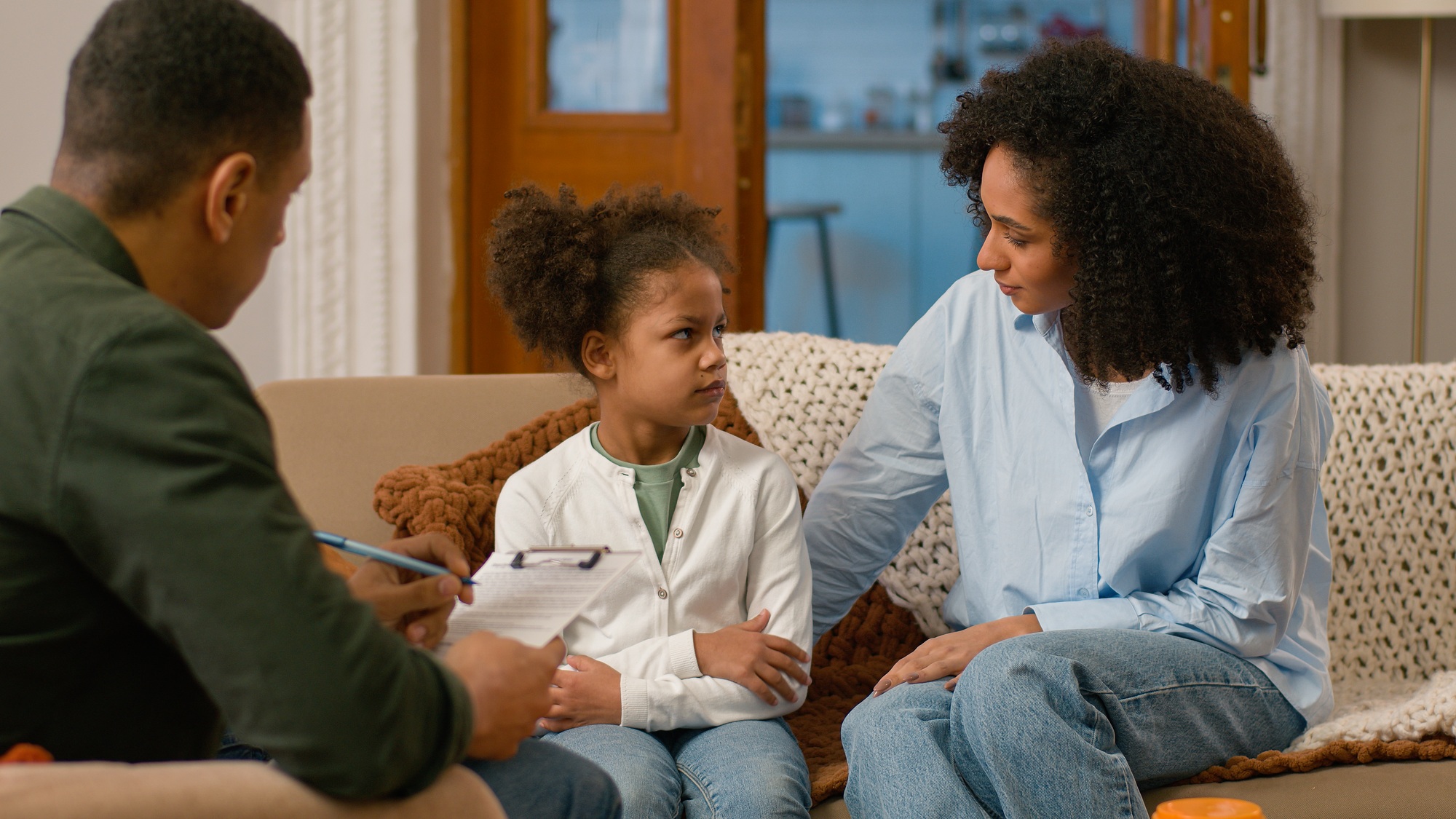 African American mother daughter together visit psychologist social worker bad relationship