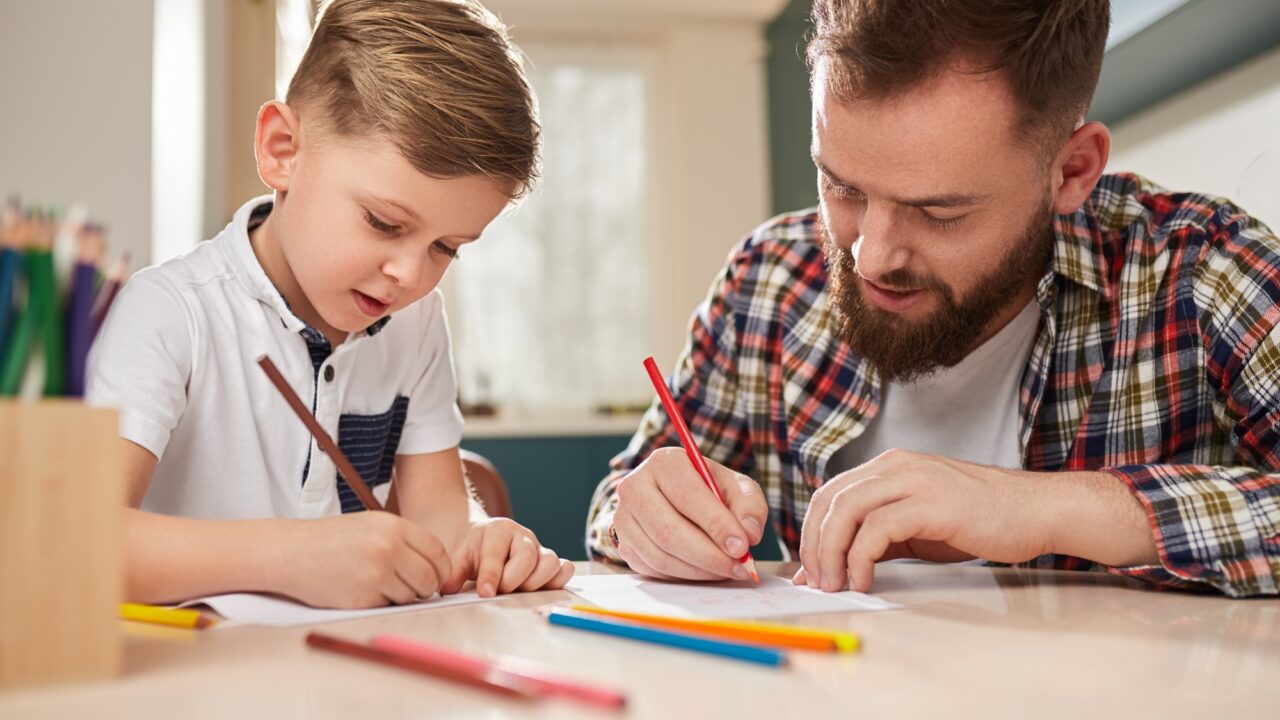 Father and son drawing together