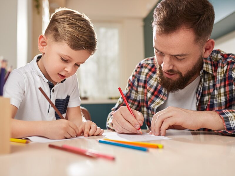 Father and son drawing together