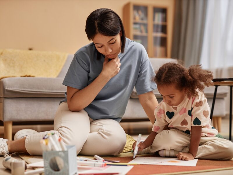 Mom Watching Preschool Daughter Drawing