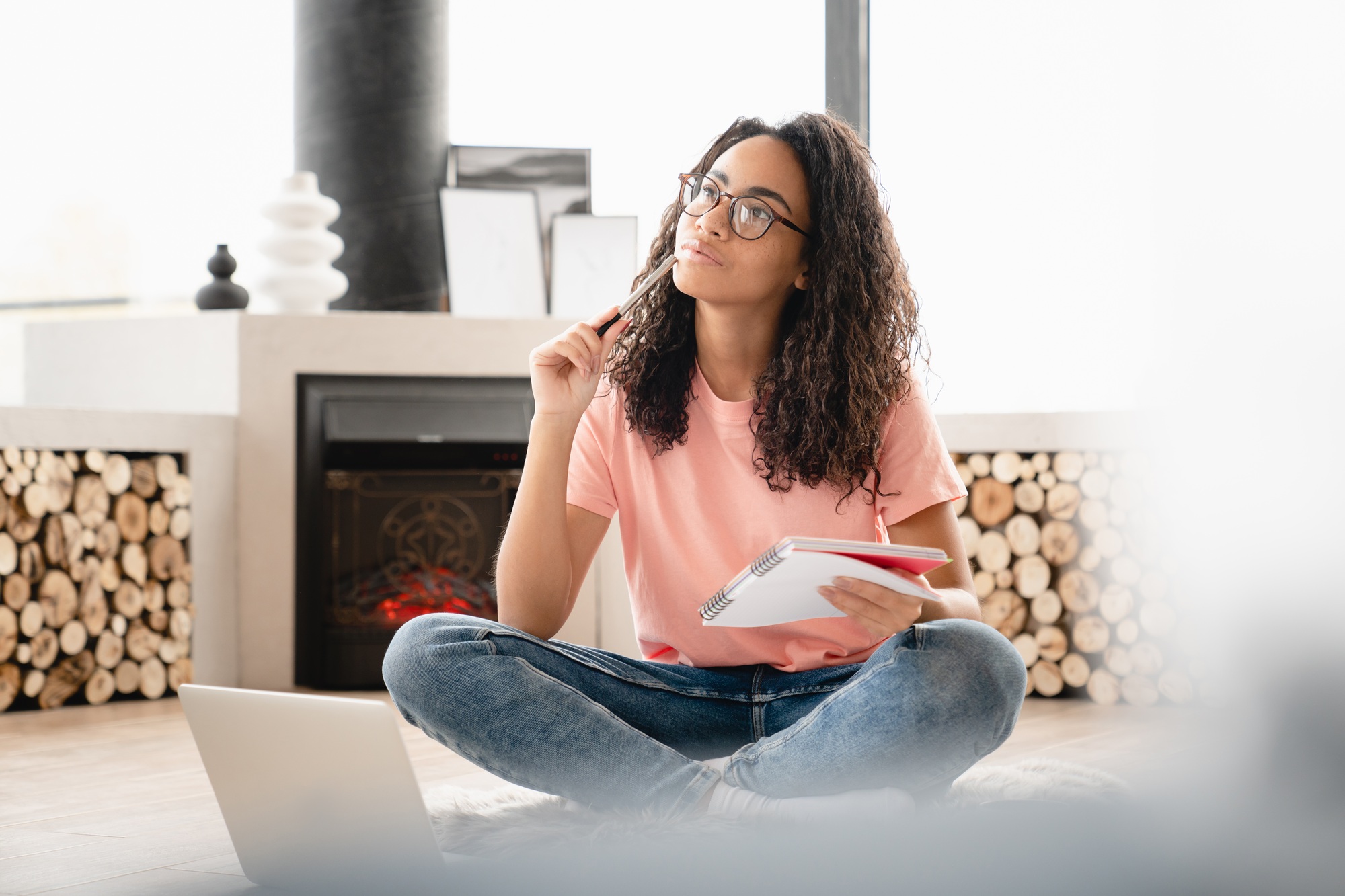 Dreamy thoughtful pensive young woman author student doing paperwork, writing poetry novels