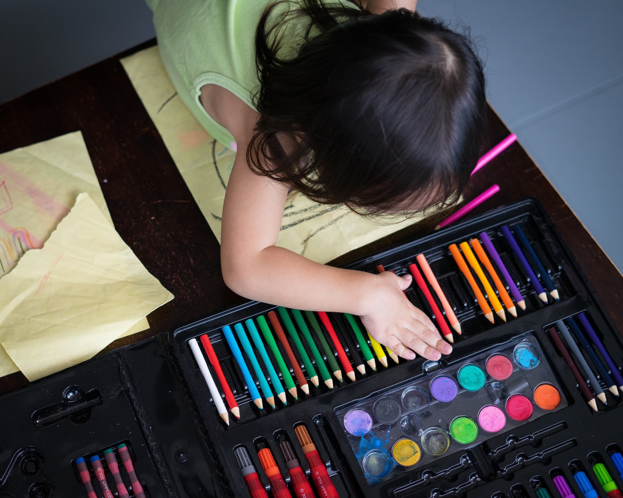 little girl choosing colours for drawing time.